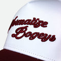 Close-up of a white snapback cap with dark red embroidered text reading 'Normalize Bogeys' on the front panel, with a dark red visor edge visible at the bottom.