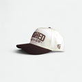 Flushed Golf & Co golf hat with contrasting brown brim, side view