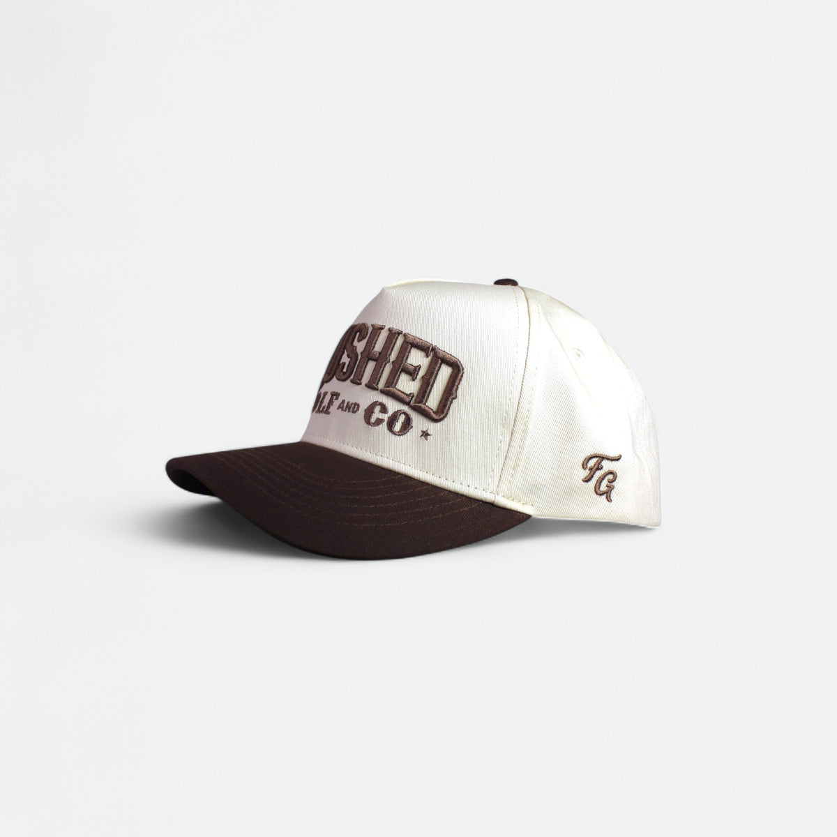 Flushed Golf & Co golf hat with contrasting brown brim, side view