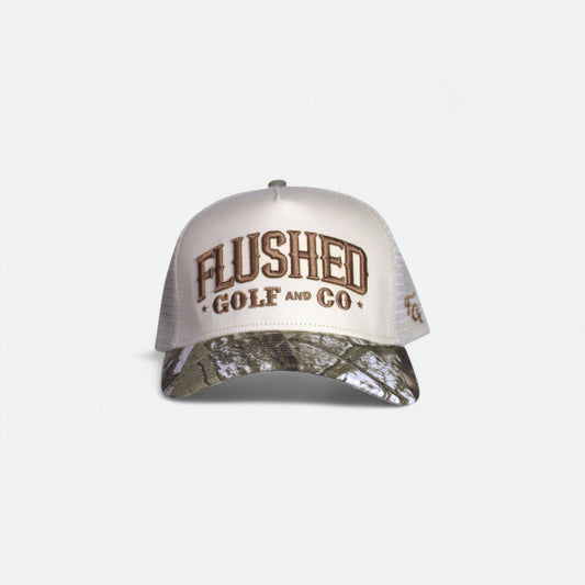 Flushed Golf & Co mesh trucker hat with embroidered logo and camo brim, front view