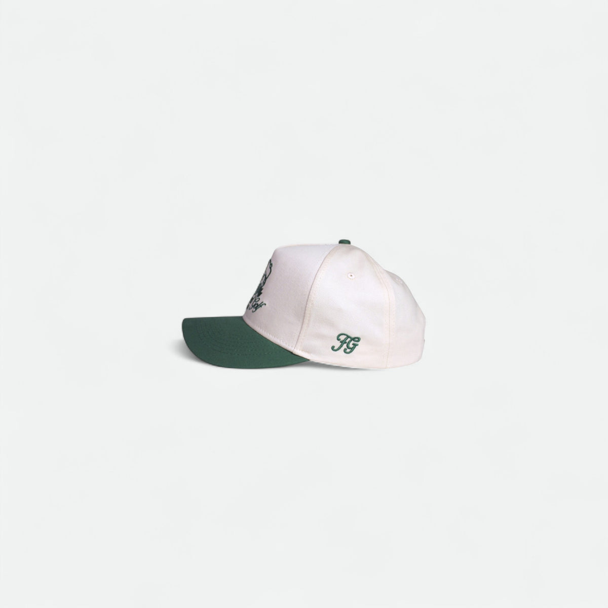 Side profile of the Flushed Golf Classic cotton golf cap with green brim