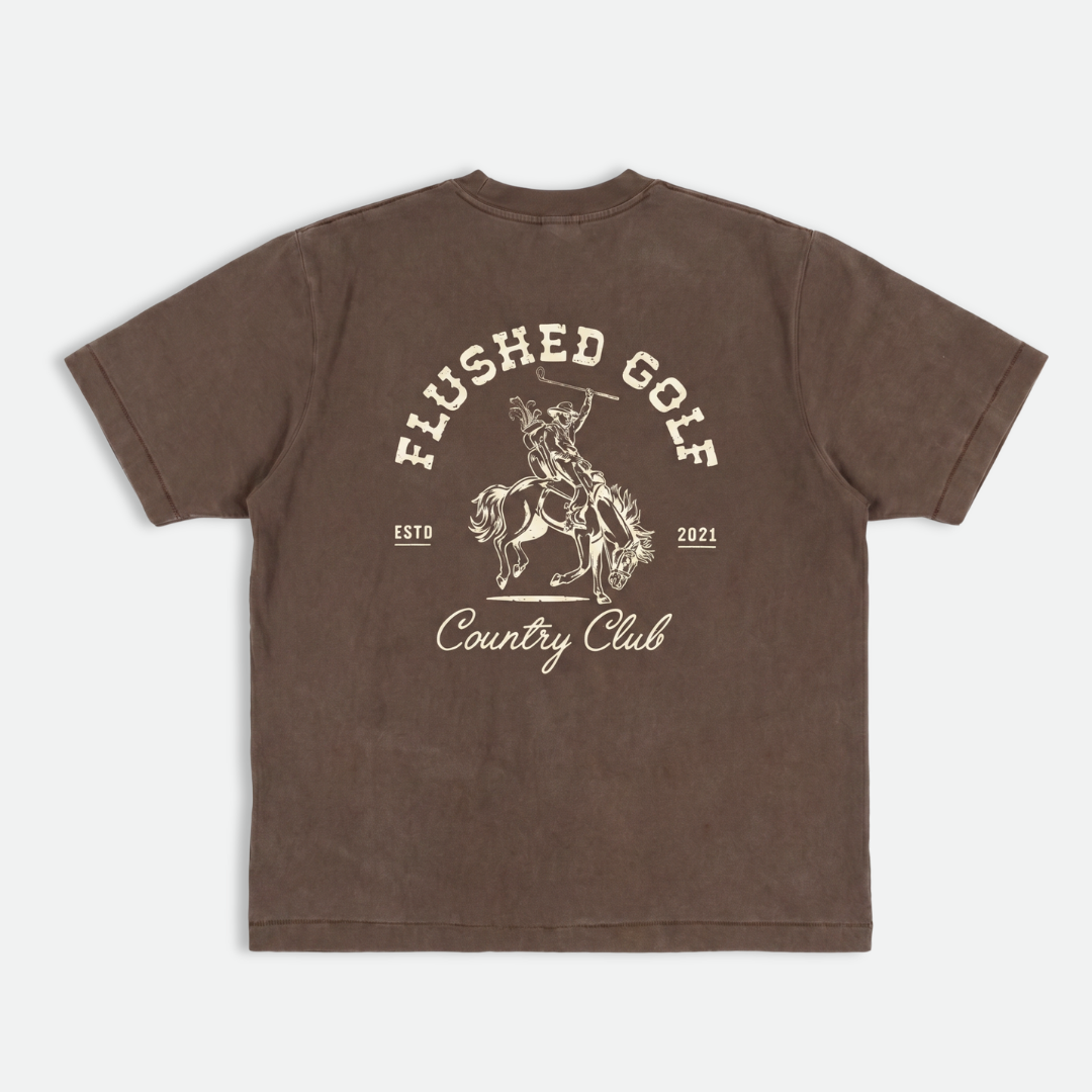 Brown heavy weight cotton t-shirt with 'Flushed Golf Country Club' graphic on a white background