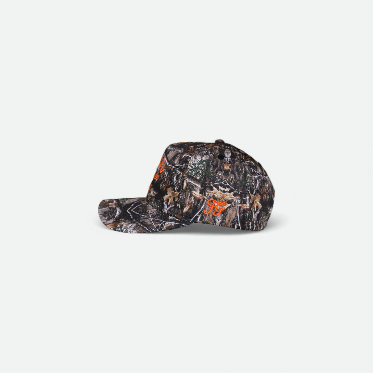 Side view of Flushed Golf camo hat with orange embroidered detail