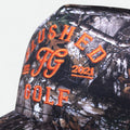 FG camo golf hat with orange embroidery, side view