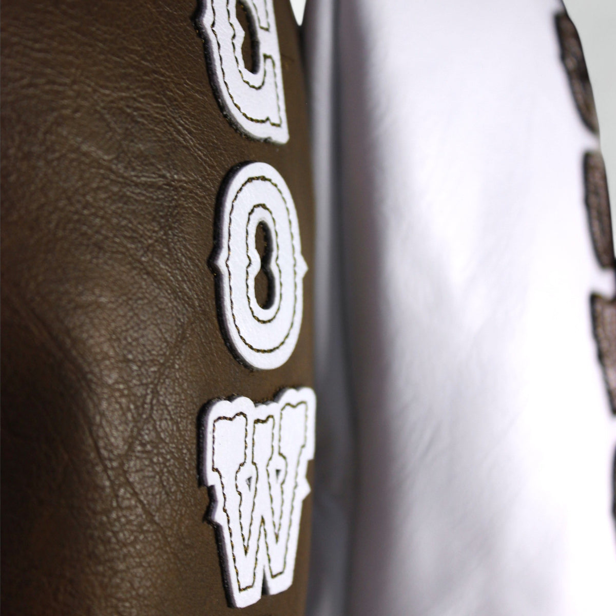 Leather patch logo detail on Flushed Golf His & Hers headcover