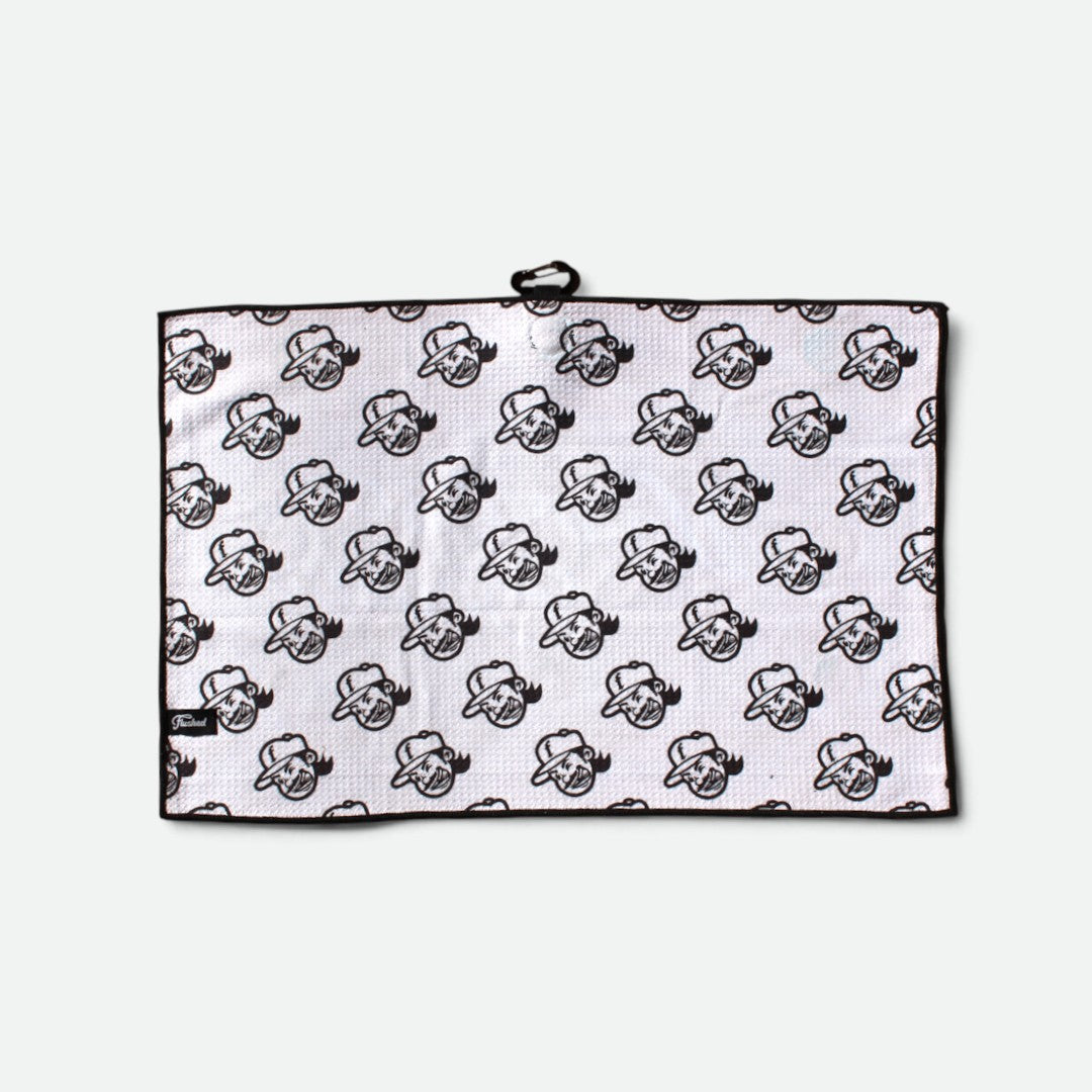 A waffle golf towel with a black border and an all-over repeating flushed golf mascot pattern, shown flat against a light gray background.